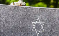 Man arrested over vandalism at Jewish cemetery