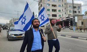 MK Sukkot marches through Huwara with Israeli flag