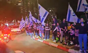 Residents of Hod Hasharon cheer for freed hostages