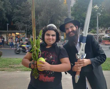 Shaking the 4 species with Chabad