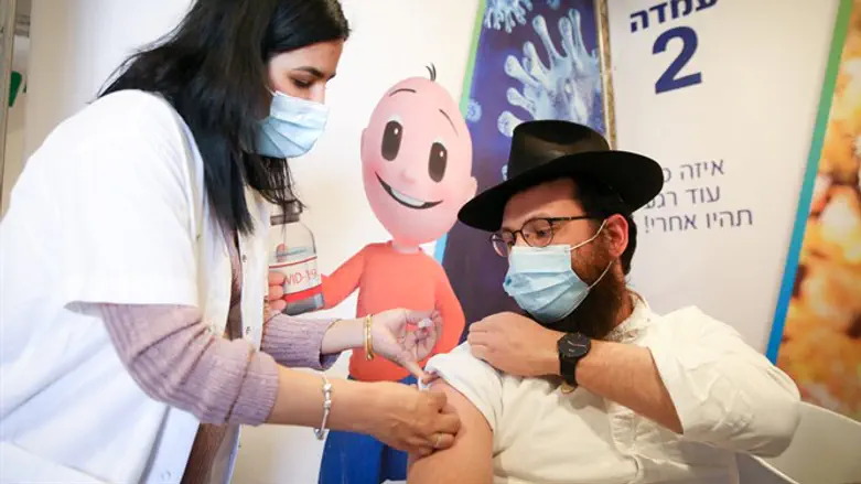 Israelis receive a Covid-19 vaccine, at a vaccination center in Tzfat