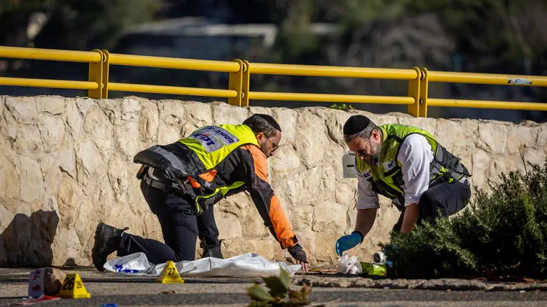 ZAKA volunteers at the scene of the bombing at the entrance to Jerusalem two weeks ago