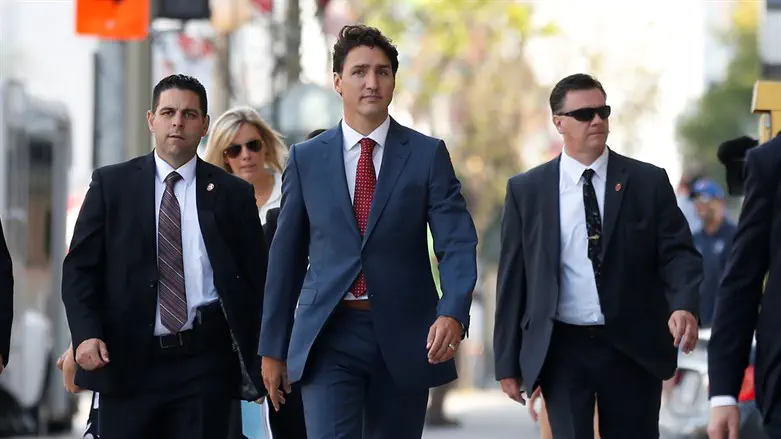 Trudeau flanked by RCMP security detail