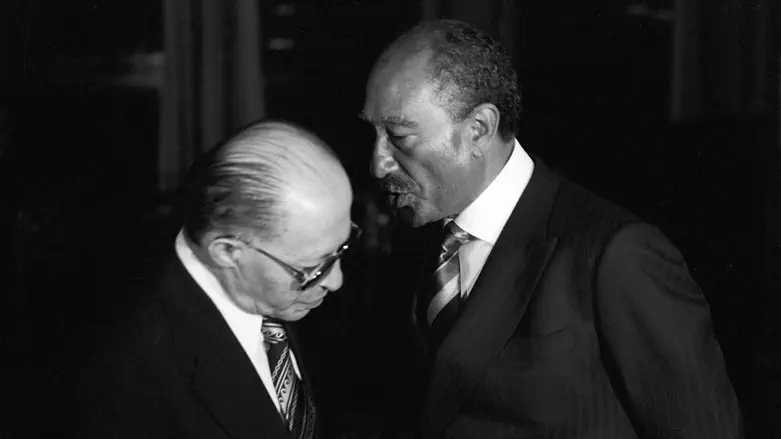 Egyptian President Anwar Saadat and Prime Minister Menachem Begin conversing at