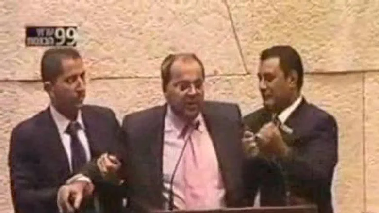 Arab MK Tibi Forcibly Removed from Podium