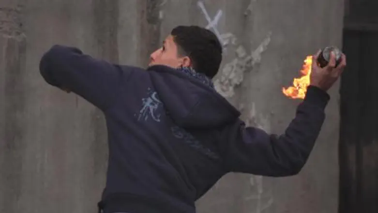 Arab youth throws firebomb (file)