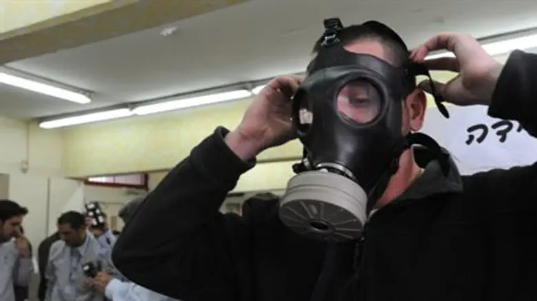 Man tries on gas mask (illustrative)