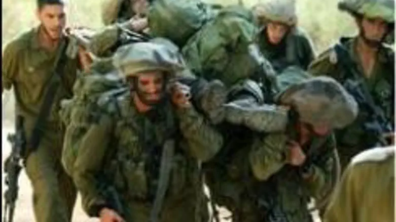Soldiers carrying  wounded comrade