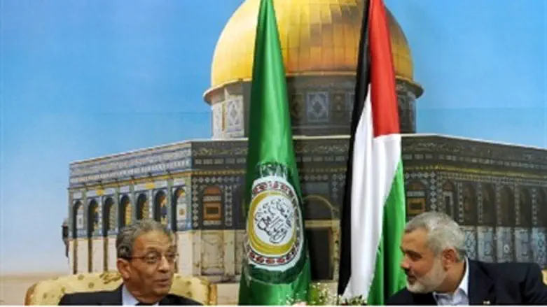 Haniyeh (right) with former Arab League head 