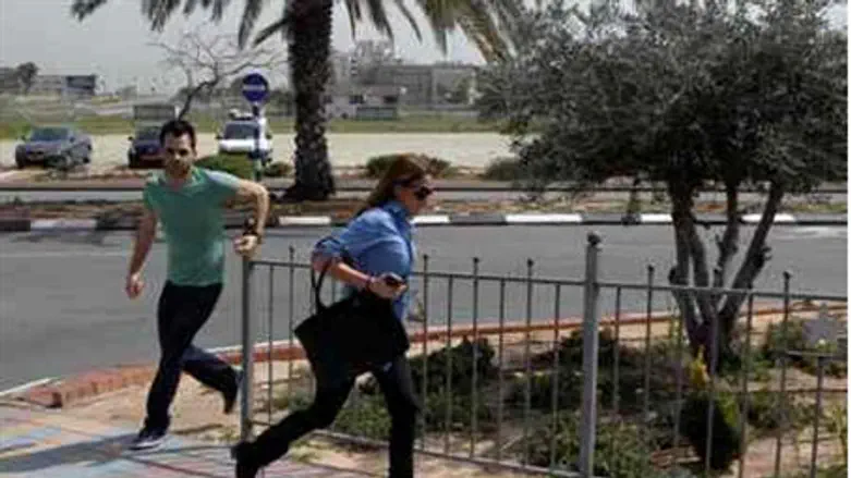 Israelis run for cover from rocket attack