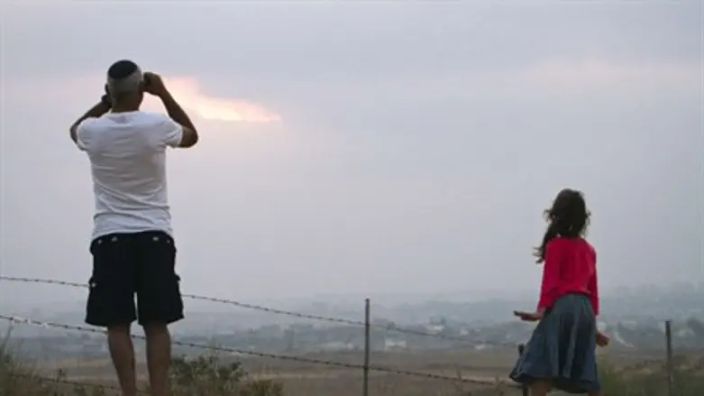 Israelis watch rocket launches from Gaza.