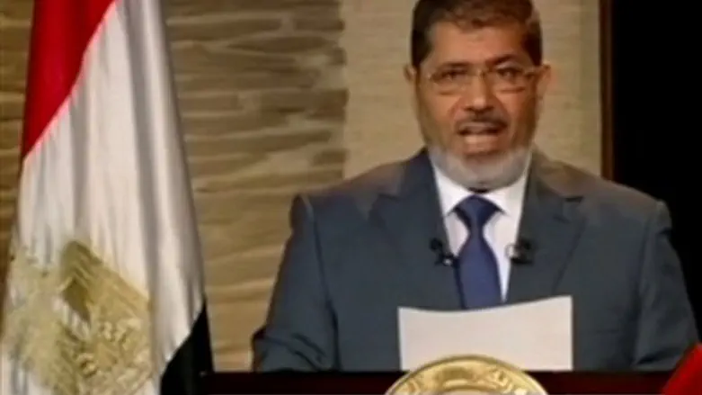  Morsi speaks during his first televised addr