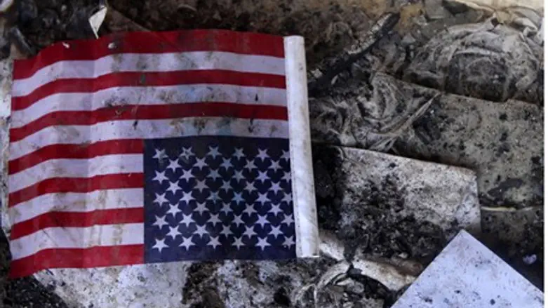 Flag among debris in U.S. consulate. 