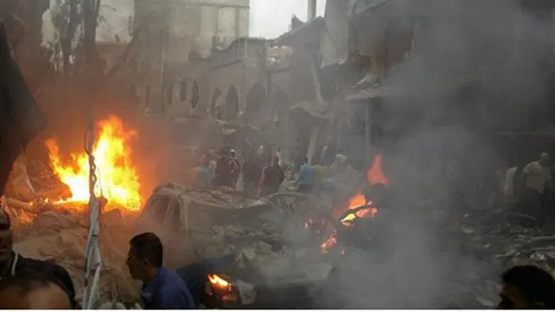 Syrians inspecting the site of a car bomb att