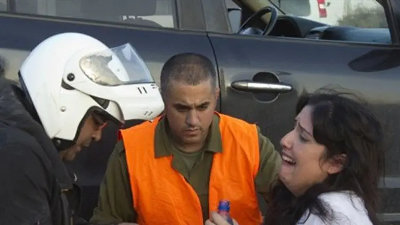 Woman reacts to rocket attack, Ofakim.