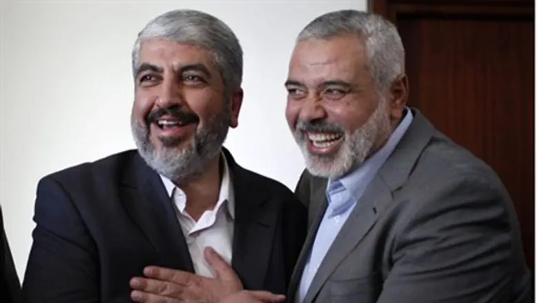 Ismail Haniyeh (R) with Hamas chief Khaled Ma