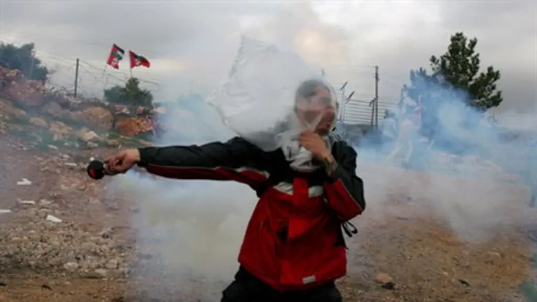 Man throws tear gas during riot