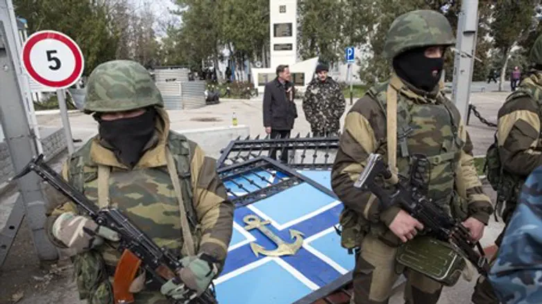 Pro-Russian gunmen stand guard after seizing 