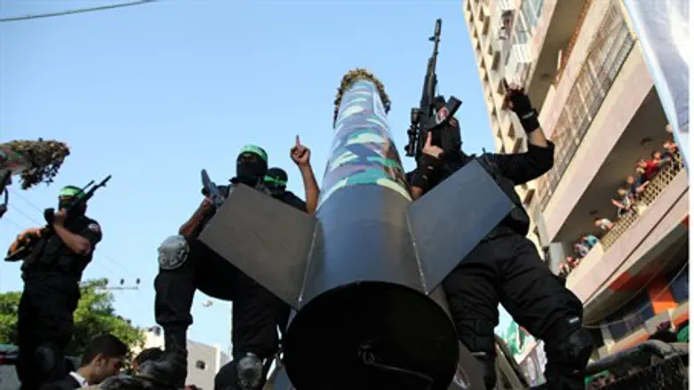 Hamas terrorists parade rocket