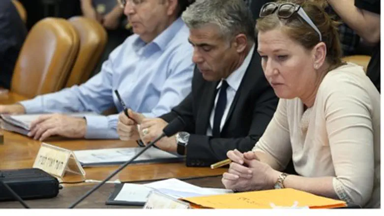 .Yair Lapid and Tzipi Livni, next to Moshe Ya