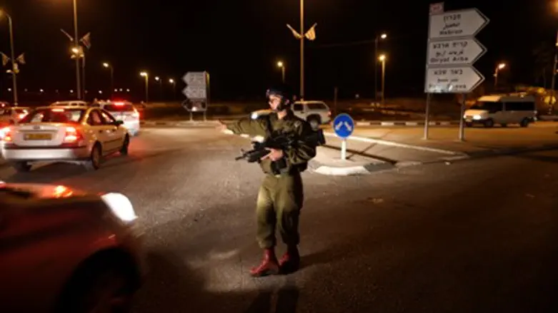IDF soldier on guard on site of the attack