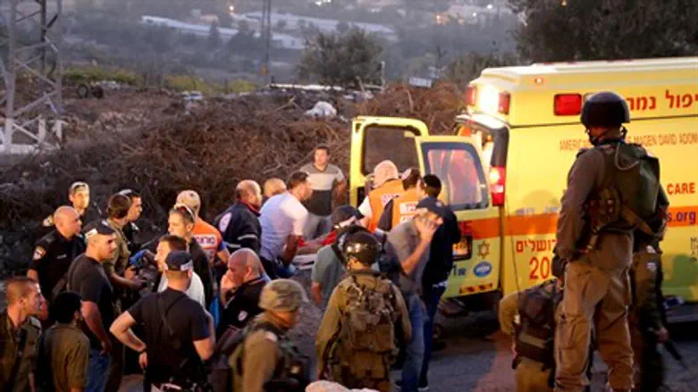 Medics evacuate the injured after Gush Etzion