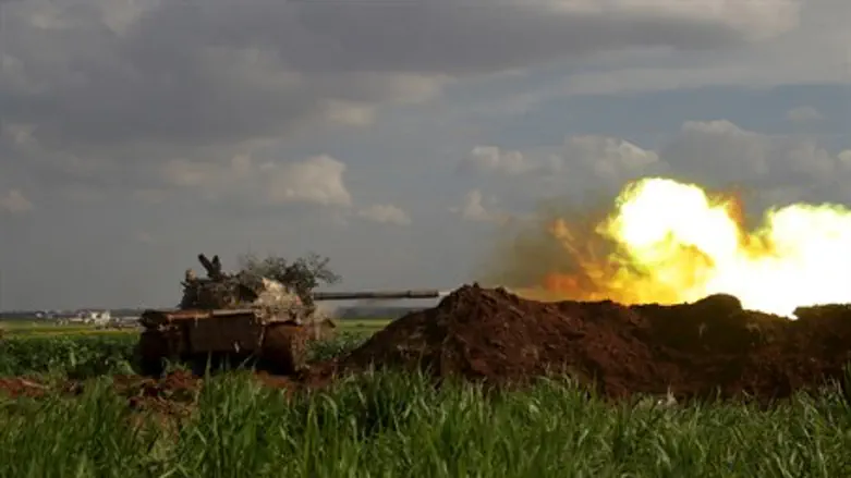Islamist rebels direct tank fire towards regime forces in Syria's Idlib