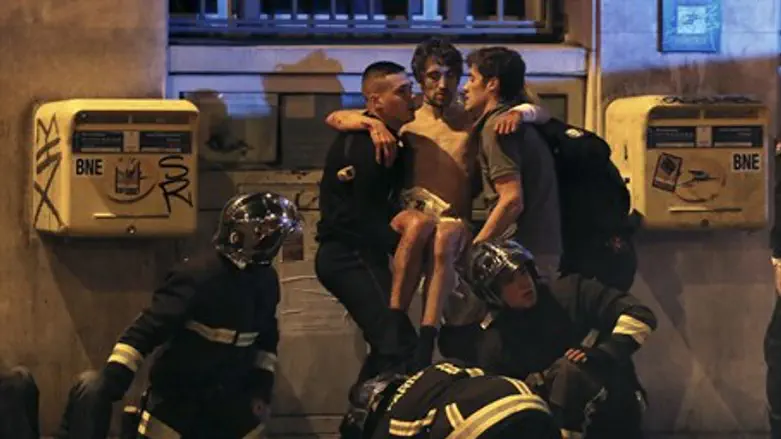French firefighters aid injured victim of Paris attacks