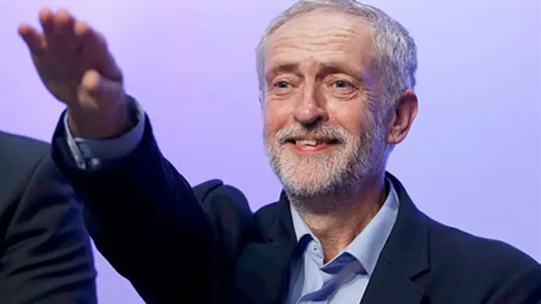 Jeremy Corbyn waves to supporters at rally