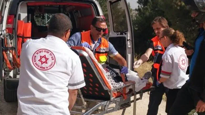 Medics evacuate elderly woman injured in the attack