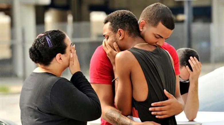 Friends and family of victims of Orlando gayclub shooting react outside police station
