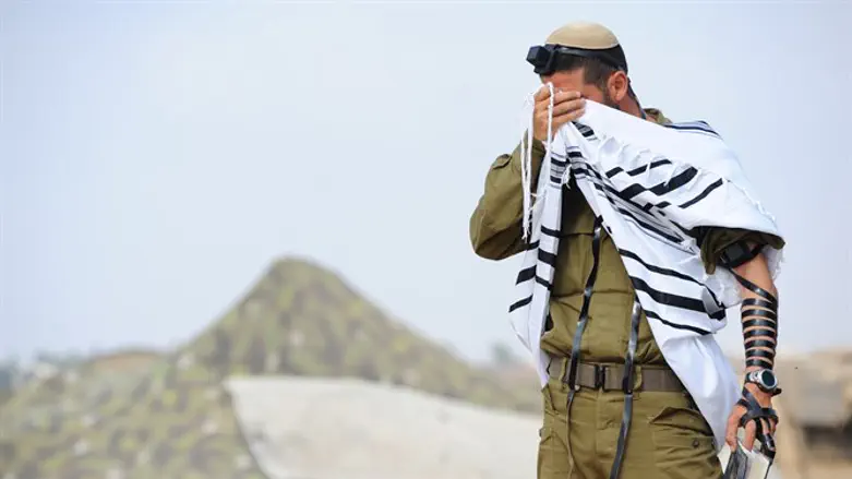 Religious soldier prays (illustration) 