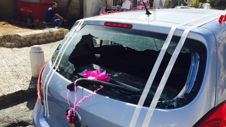 Vandalized car of visitor to Mount of Olives