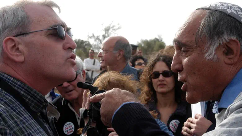 Moshe Zar (R) confronts Peace Now at Gilad Farm