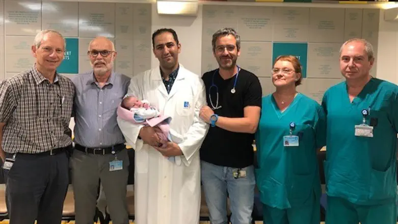 Baby Bina with the operating team