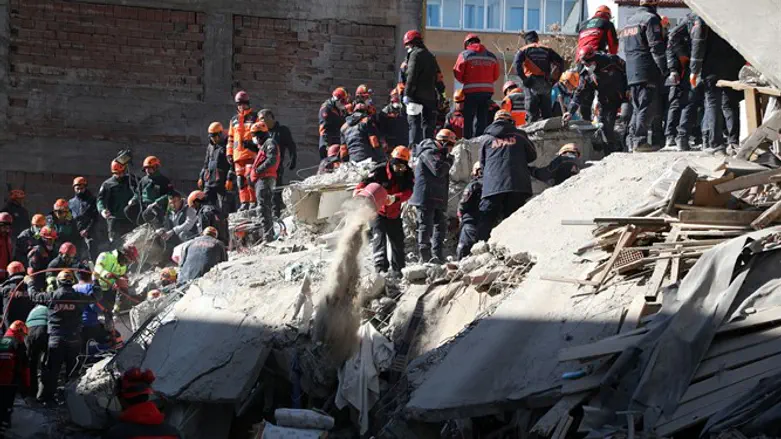Search and rescue teams work on a collapsed building after an earthquake Elazig