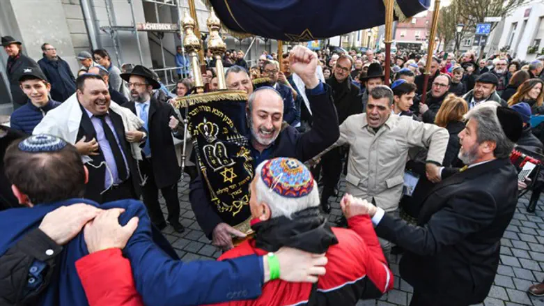 Jews dance with a Torah during the rededication of a synagogue in Konstanz