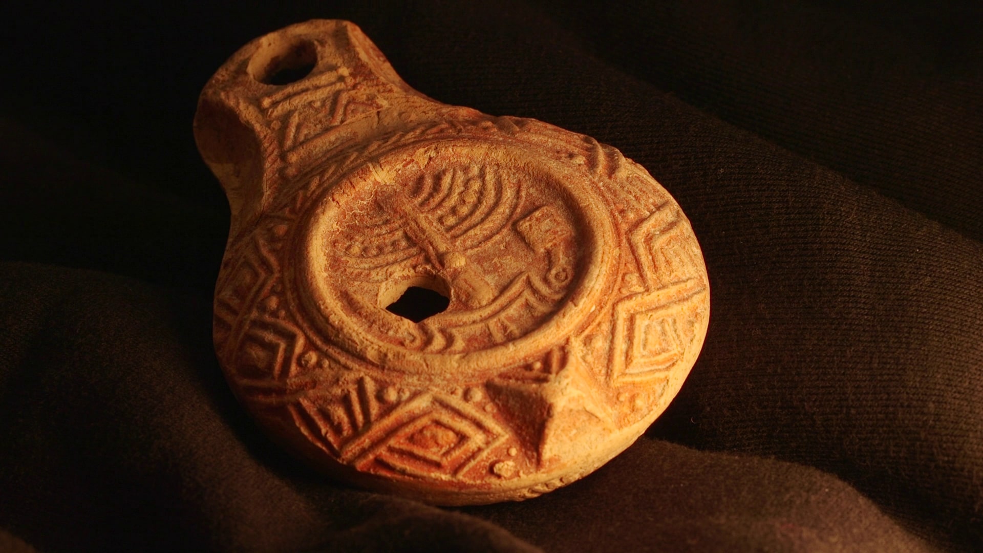 The ancient oil lamp, decorated with - menorah, incense shovel and lulav               