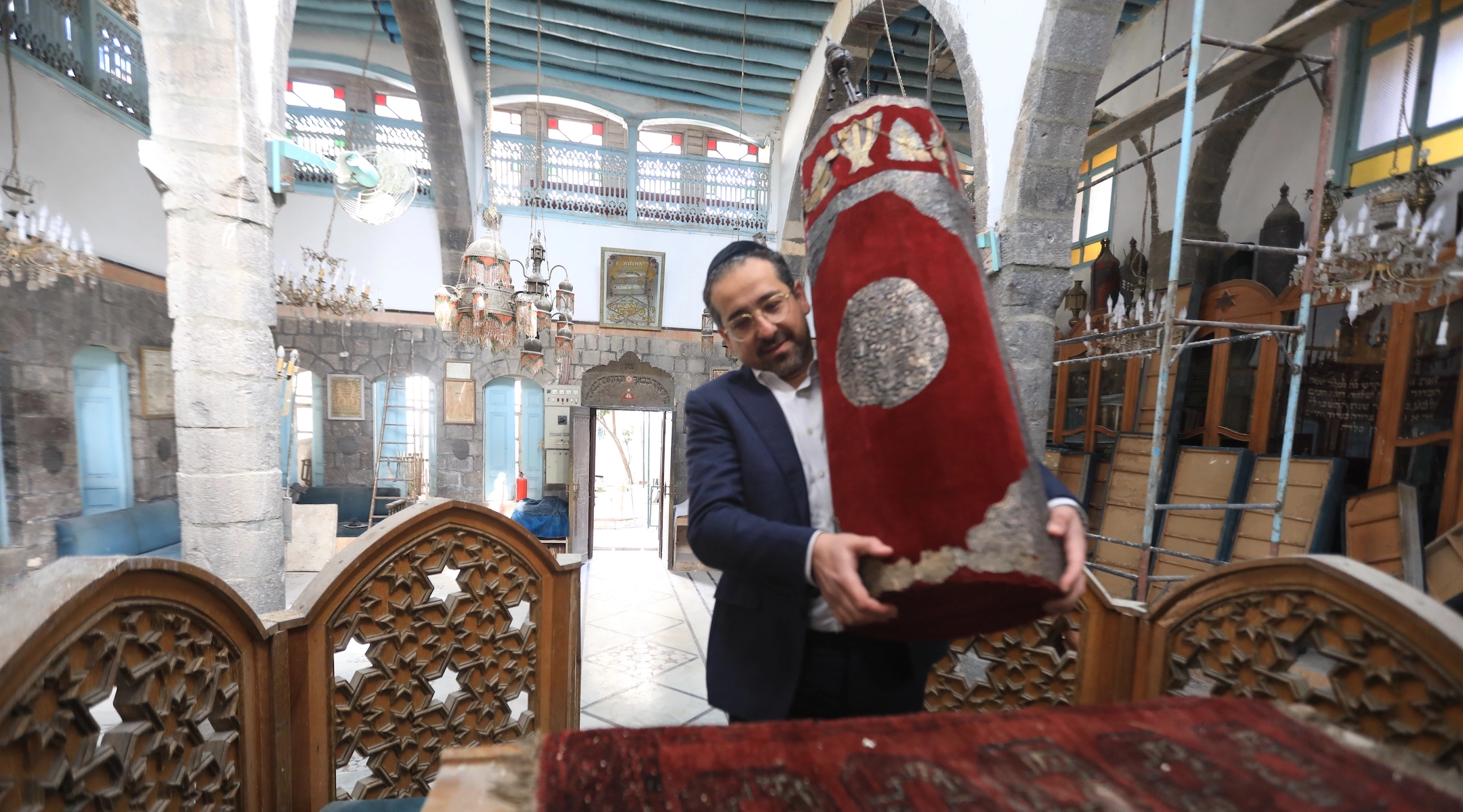 Syrian Rabbi Yousef Hamra and accompanying Jews visit the Frenc and Raki churches, the Maimonides Jewish School and the Jobar Synagogue, which was largely destroyed during the civil war, in the historic districts of Damascus, Syria on February 18, 2025. Yousef Hamra, who was forcibly migrated from Syria in 1992, arrived in the Syrian capital Damascus after 33 years.                                              Credit: Bakr Al Kasem/Anadolu via Getty Images