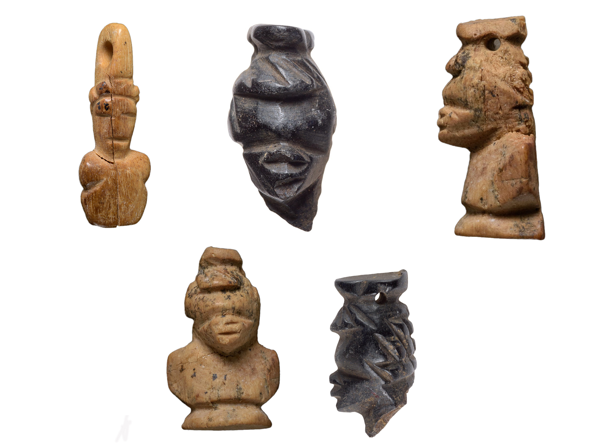 Heads of carved African figures discovered at the site may attest to the origin of the buried people.