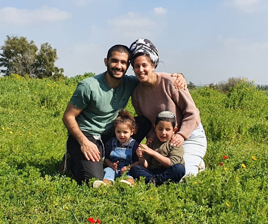 Major Tal Cohen, Natali and two of their three sons in happier times 