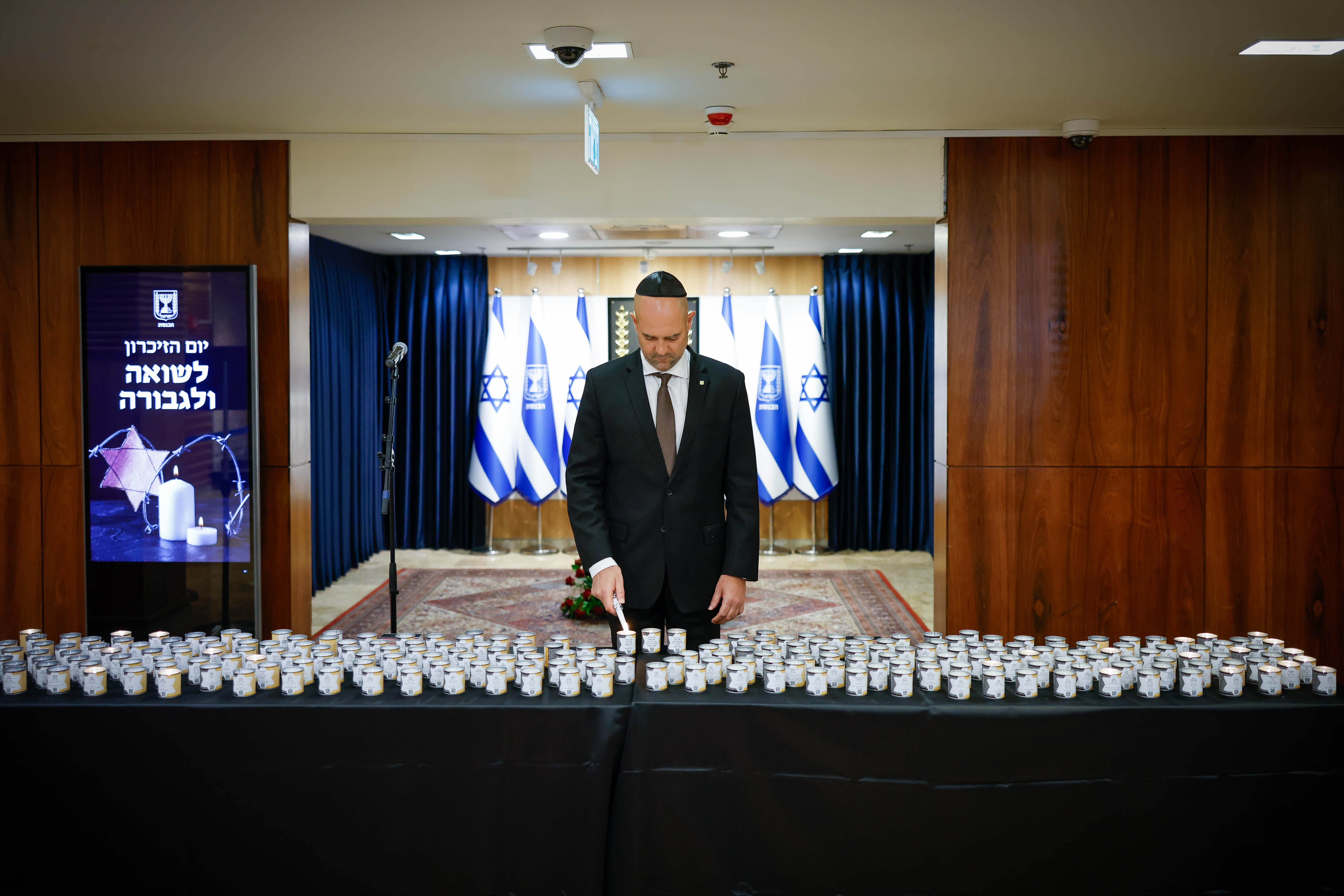 Knesset Speaker Amir Ohana lights a memorial candle 