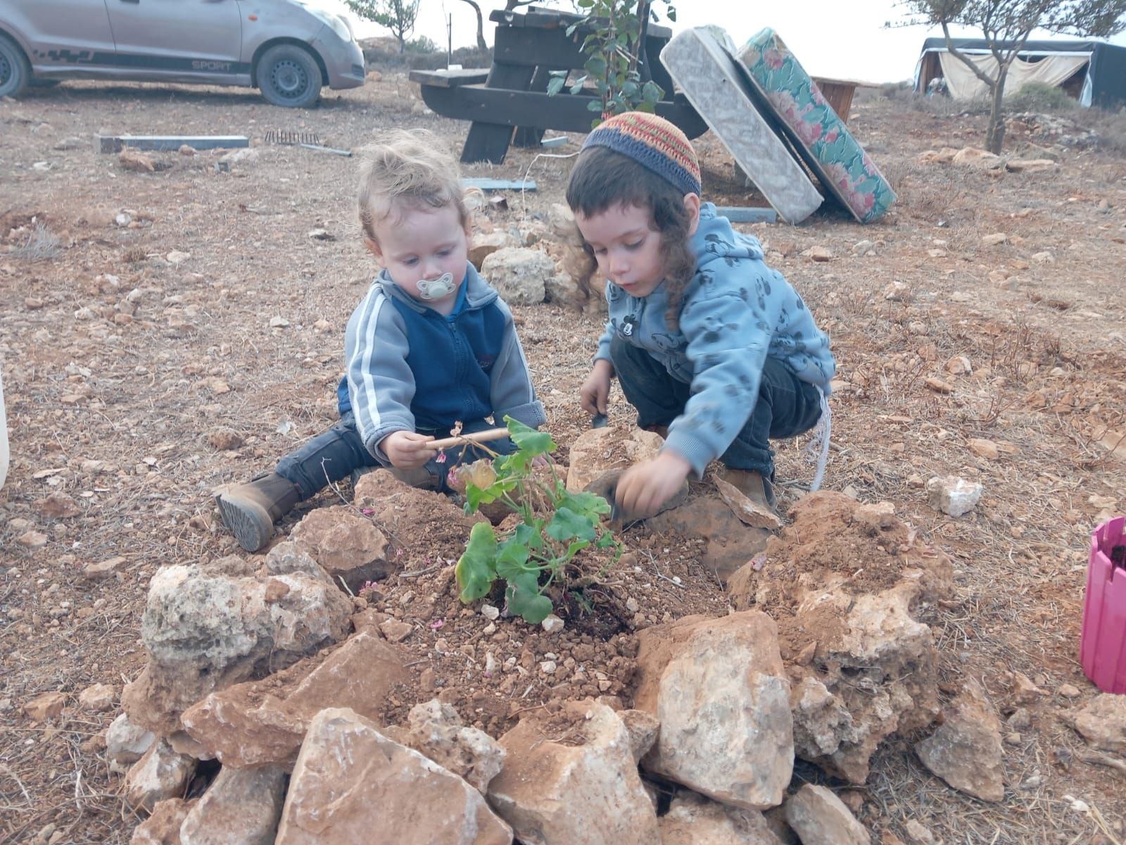 Hilltop community children planting