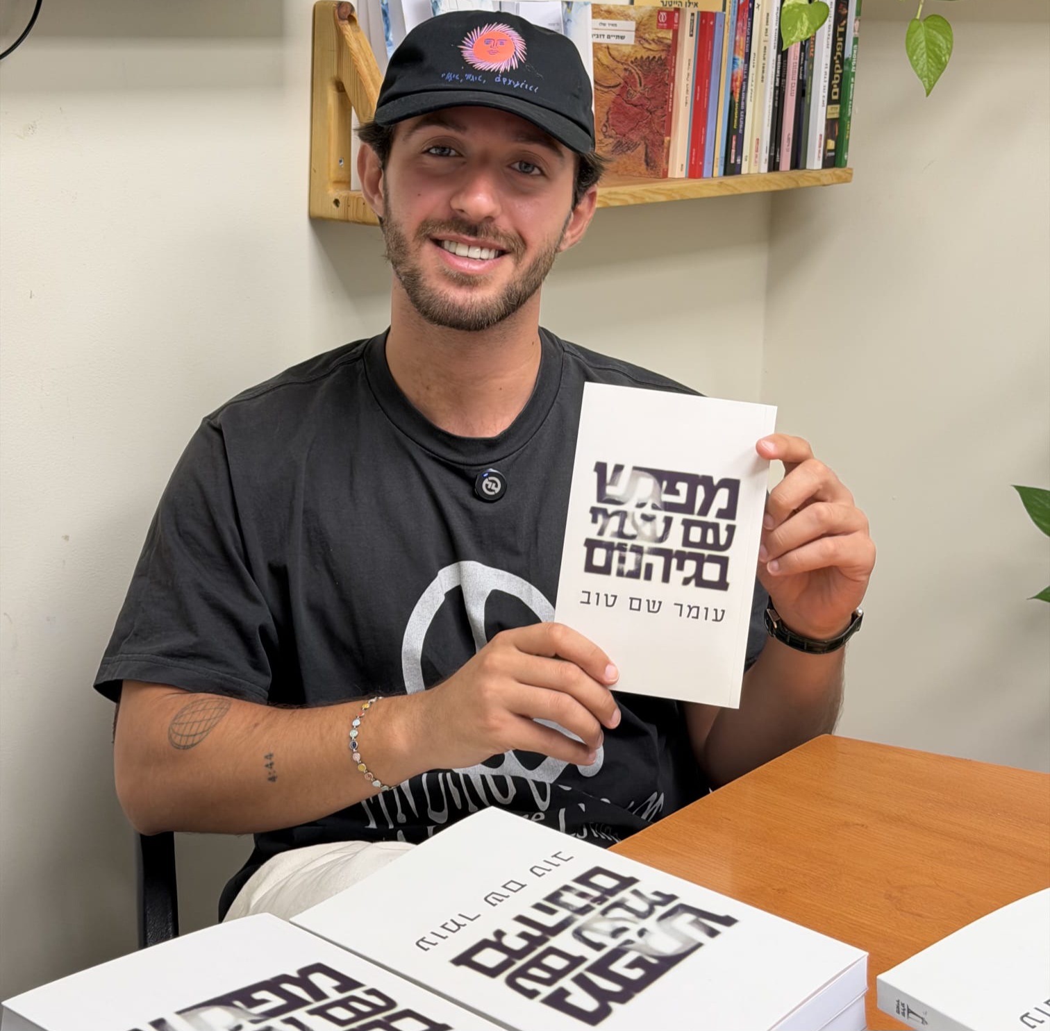 Omer Shem Tov with his new book Courtesy of the photographer