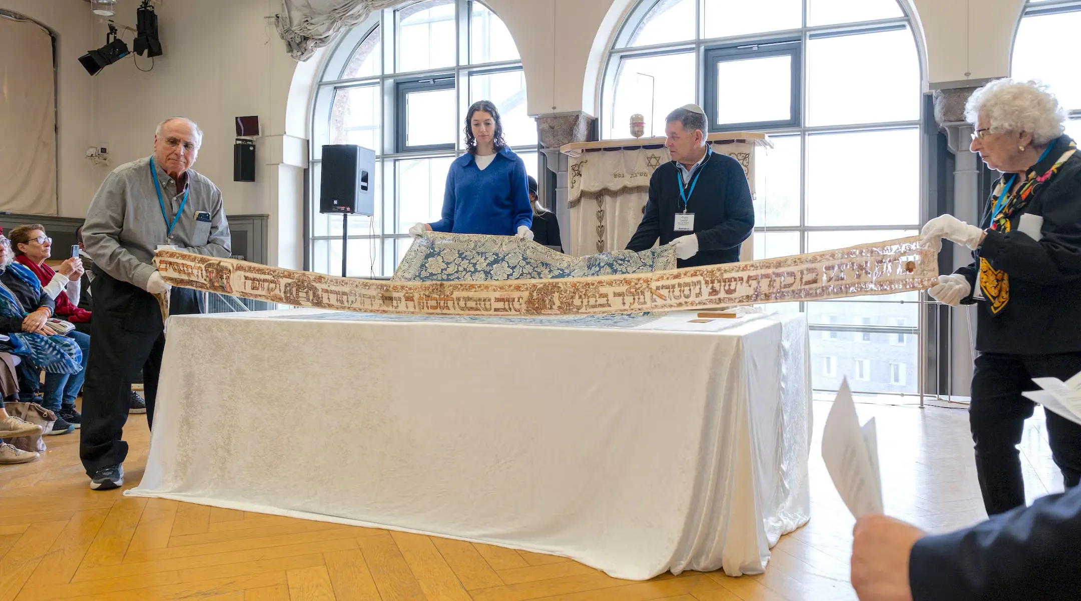 The centuries-old Jewish ritual textiles, stolen during Kristallnacht in 1938 and traded after the war to a survivor for coffee and tobacco, are returned to the Berlin Jewish community during a ceremony at the New Synagogue Berlin-Centrum Judaicum, Oct. 22, 2026.