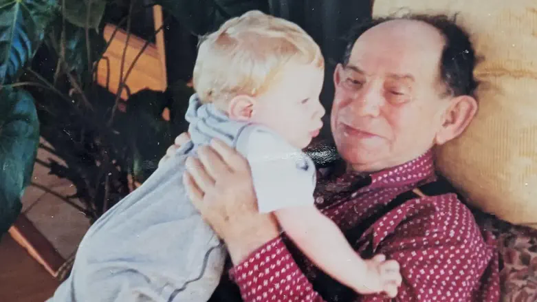 Abraham Waserstein as a child with his grandfather, Szmul Wasersztein.                                         Credit: Abraham Waserstein