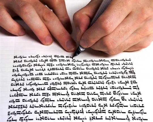 Scribe writing Torah scroll