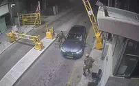 Watch: Young woman tries to breach checkpoint, hits soldier