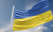 Ukrainian official hits Russian delegate who took flag at summit