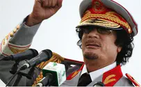Qaddafi Buried in Secret Place; Explosion Kills 100